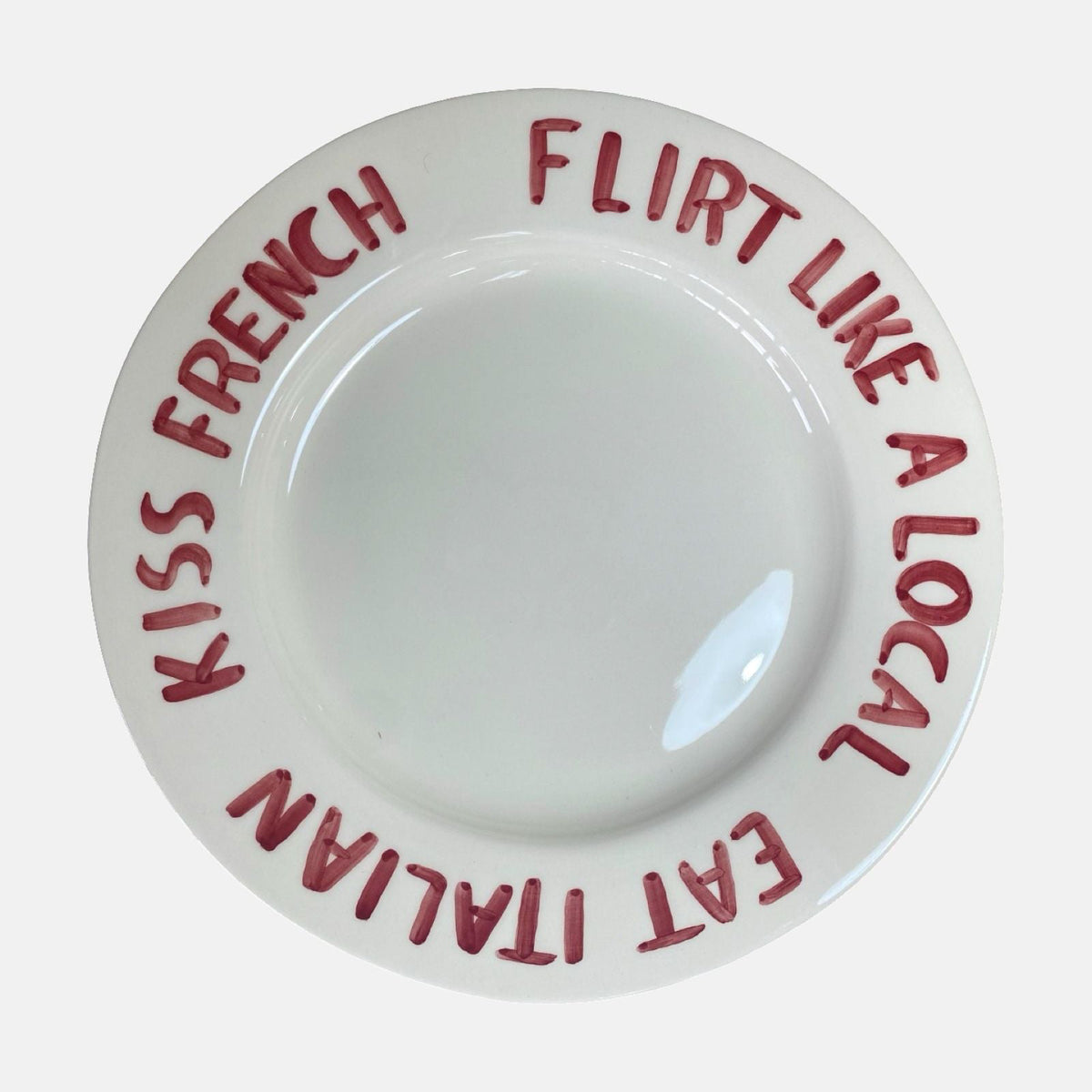 'Eat Italian, Kiss French, Flirt like a local' bord